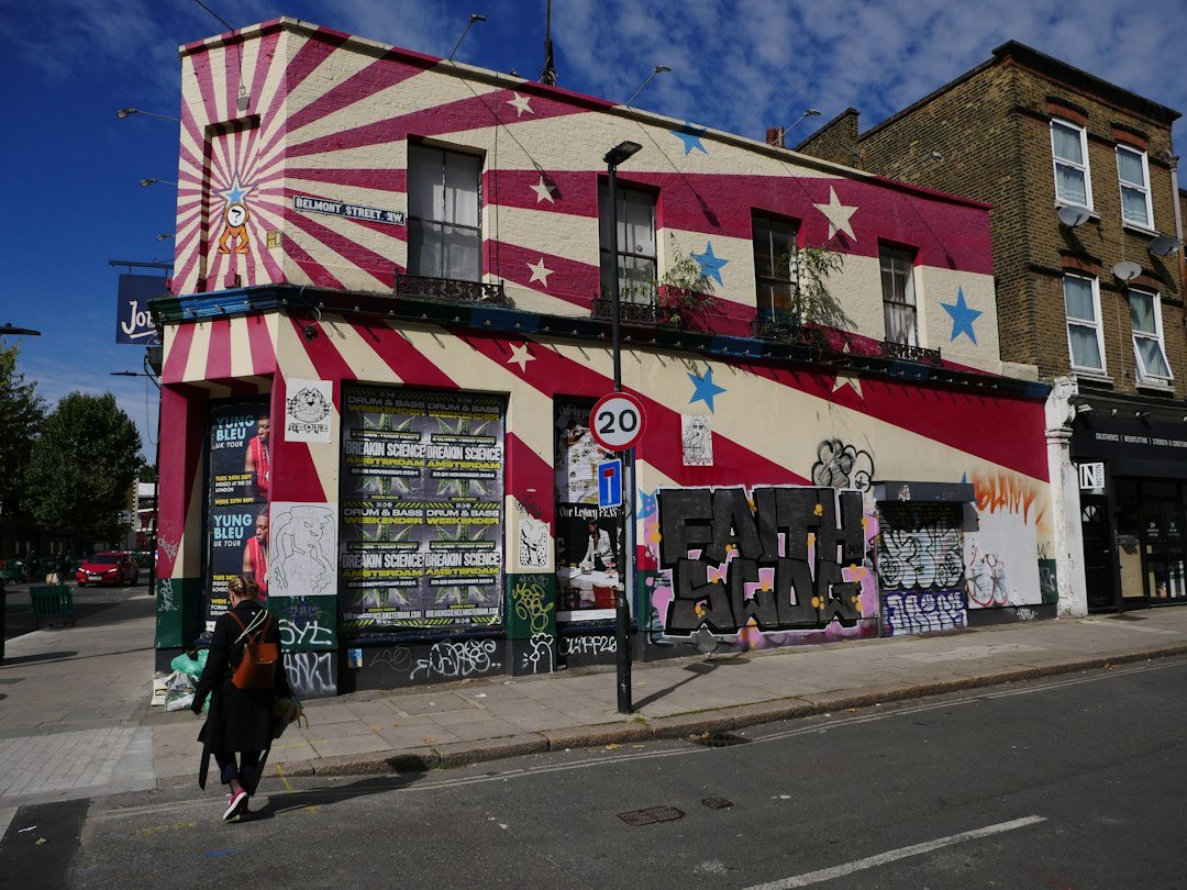 A building with a circus theme painted on the side of it