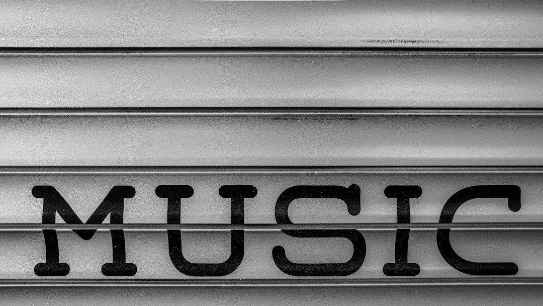 a close up of the word music written in black and white