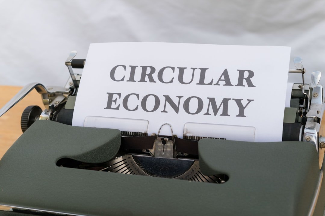 a close up of a typewriter with a paper that reads circular economy